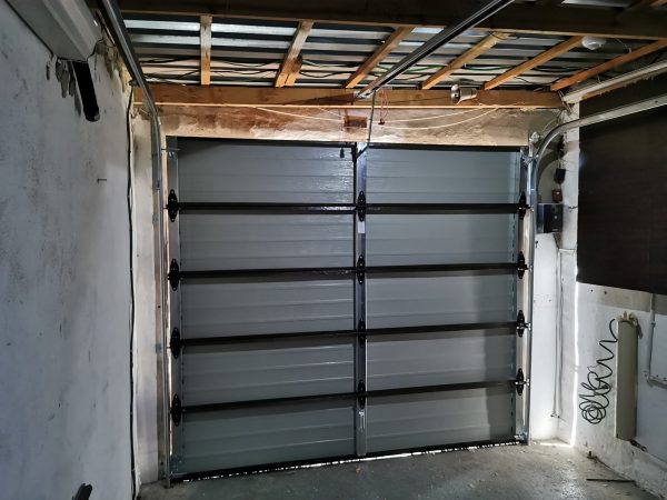 inside garage with single steel garage door